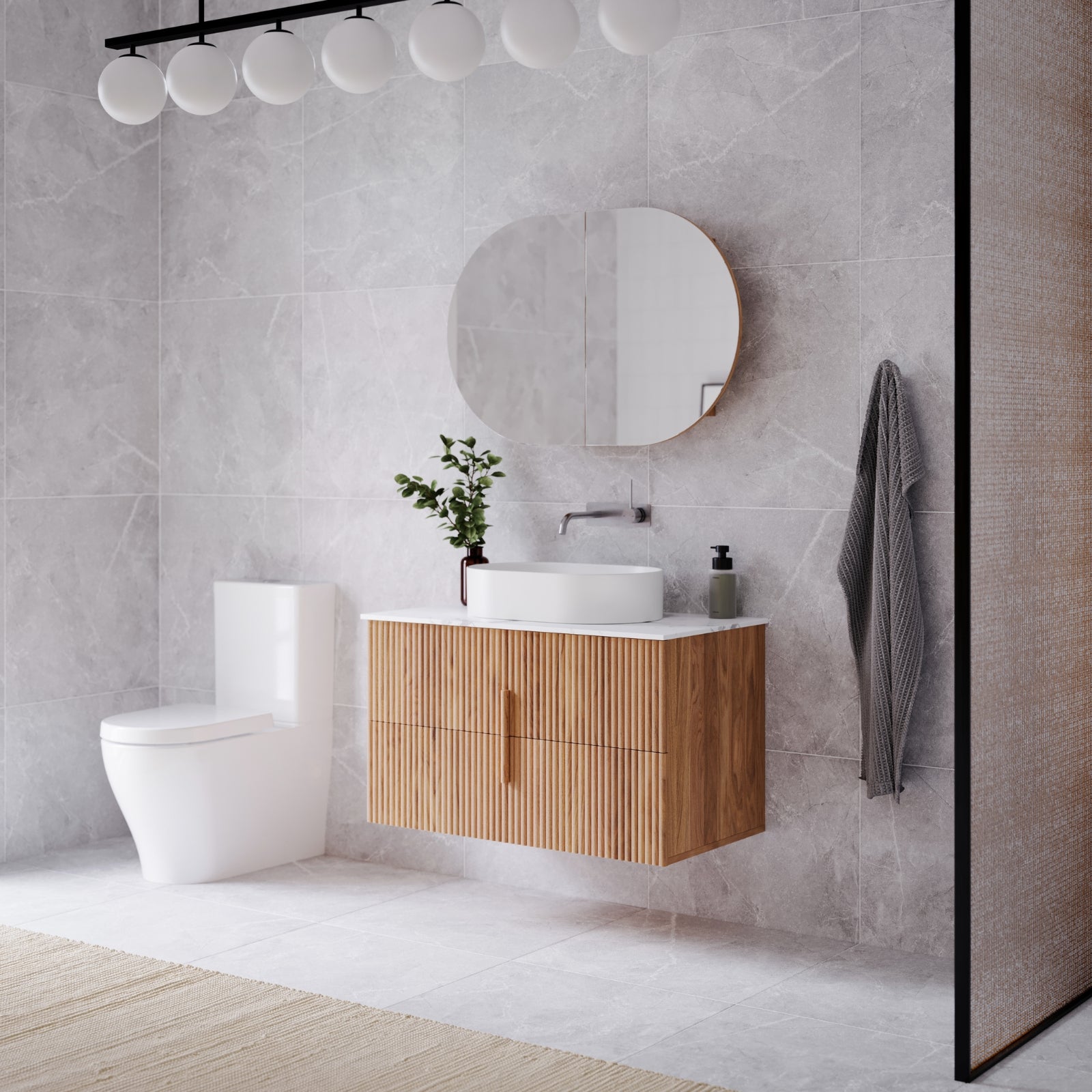 Modern bathroom with wooden vanity, round mirror, and white Caroma Luna toilet.