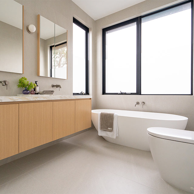 Caroma Liano brushed nickel basin and bath taps | Modern Melbourne Bathroom Renovation | The Blue Space