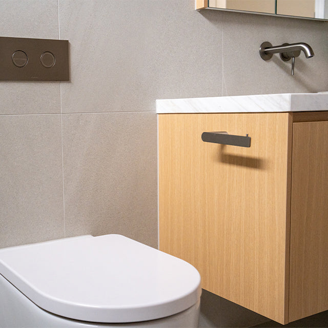 Caroma Liano brushed nickel taps, accessories and Urbane II Cleanflush toilet suite | Timberline shaving cabinet | Modern Bathroom Renovation | The Blue Space