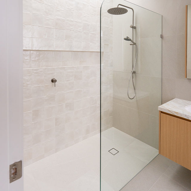 Caroma Liano brushed nickel shower taps | White Zellige square tiles | Modern Melbourne Bathroom Renovation | The Blue Space