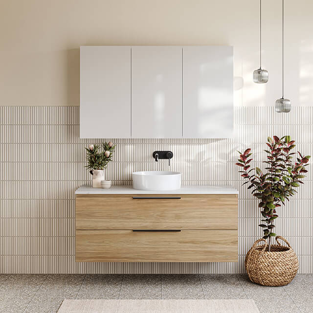 Timberline Nevada Plus Wall Hung Vanity with Above Counter Basin, timberline tennessee shaving cabinet, telbix bobo lights, white kitkat tiles and island grey terrazzo grey tiles. Caroma Liano II tapware matte black