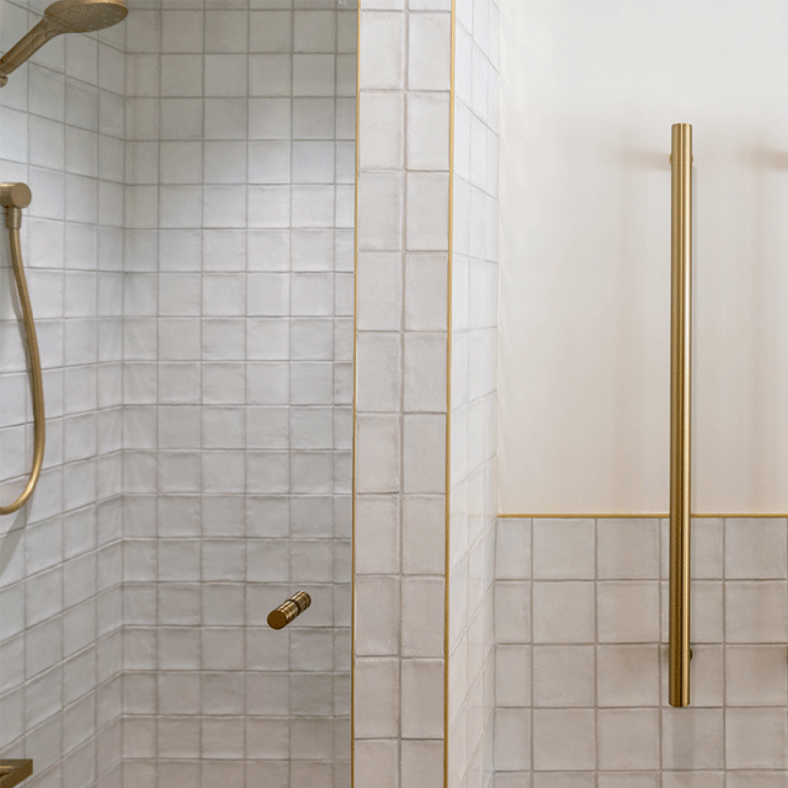 White Dianna Zellige Tile 100 x 100 x 9mm Spanish Ceramic and Phoenix brushed gold heated towel rail and Bao corner bath