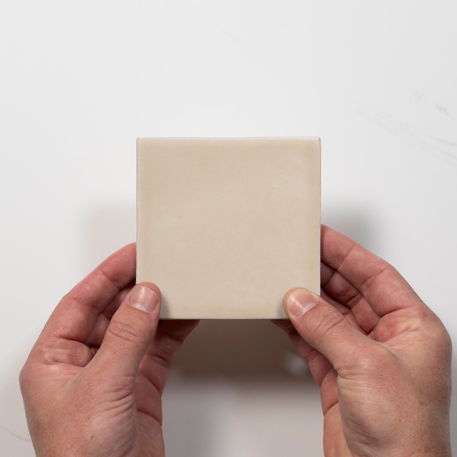 Single with Hand Evelyn Off-White Handmade Zellige Satin Tile 100 x 100mm BYREA1 - The Blue Space