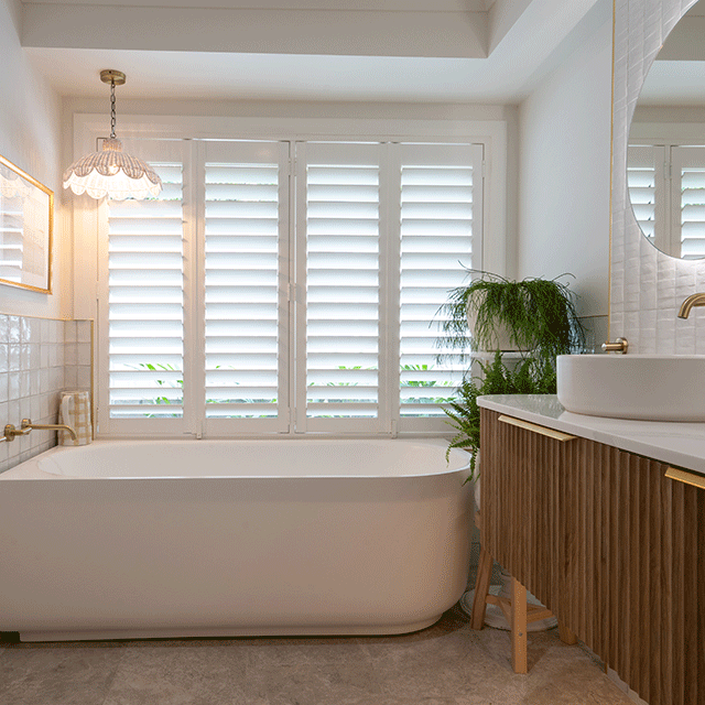 Timberline Santos Apollo Fluted Wall Hung Vanity with SilkSurface Top and Above Counter Basin. Paired with Bao corner bath, Olivia textured tiles