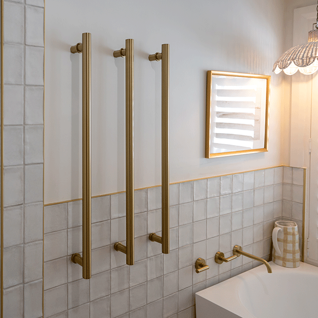 White Dianna Zellige Tile 100 x 100 x 9mm Spanish Ceramic and Phoenix brushed gold heated towel rail and Bao corner bath