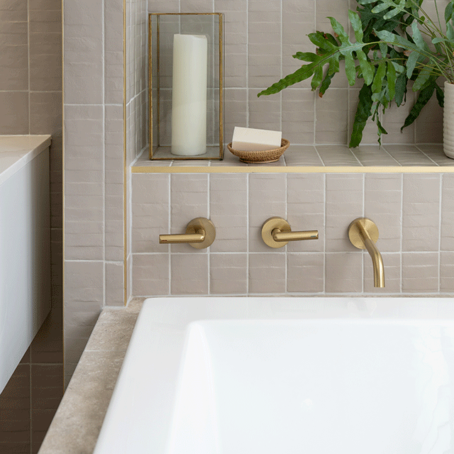 Caroma Newbury Island Plus Bath paired with the grey Olivia textured subway tile