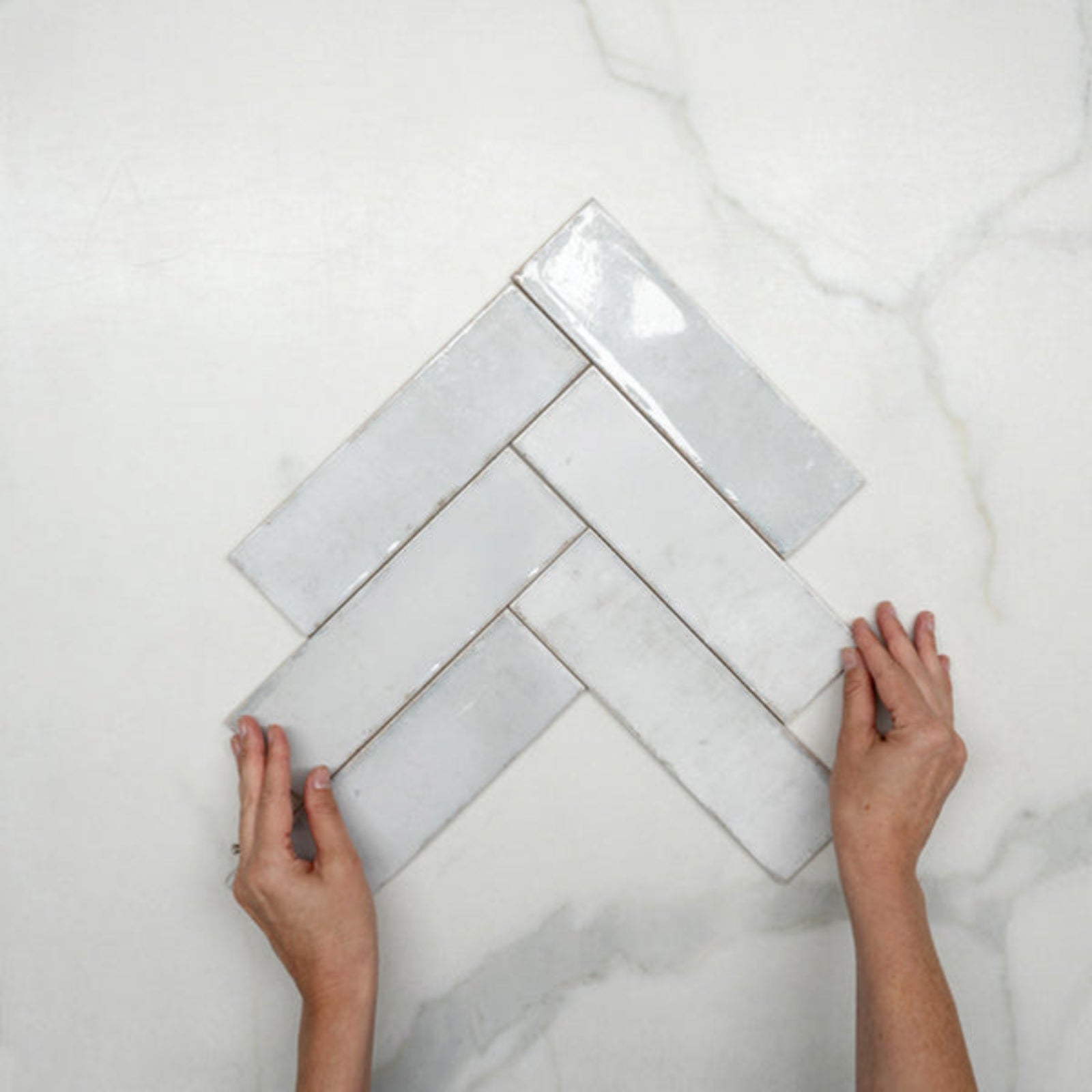 Fishbone With Hand Pearl White Leon Spanish Subway Tile Gloss 69 x 240mm Ceramic - The Blue Space