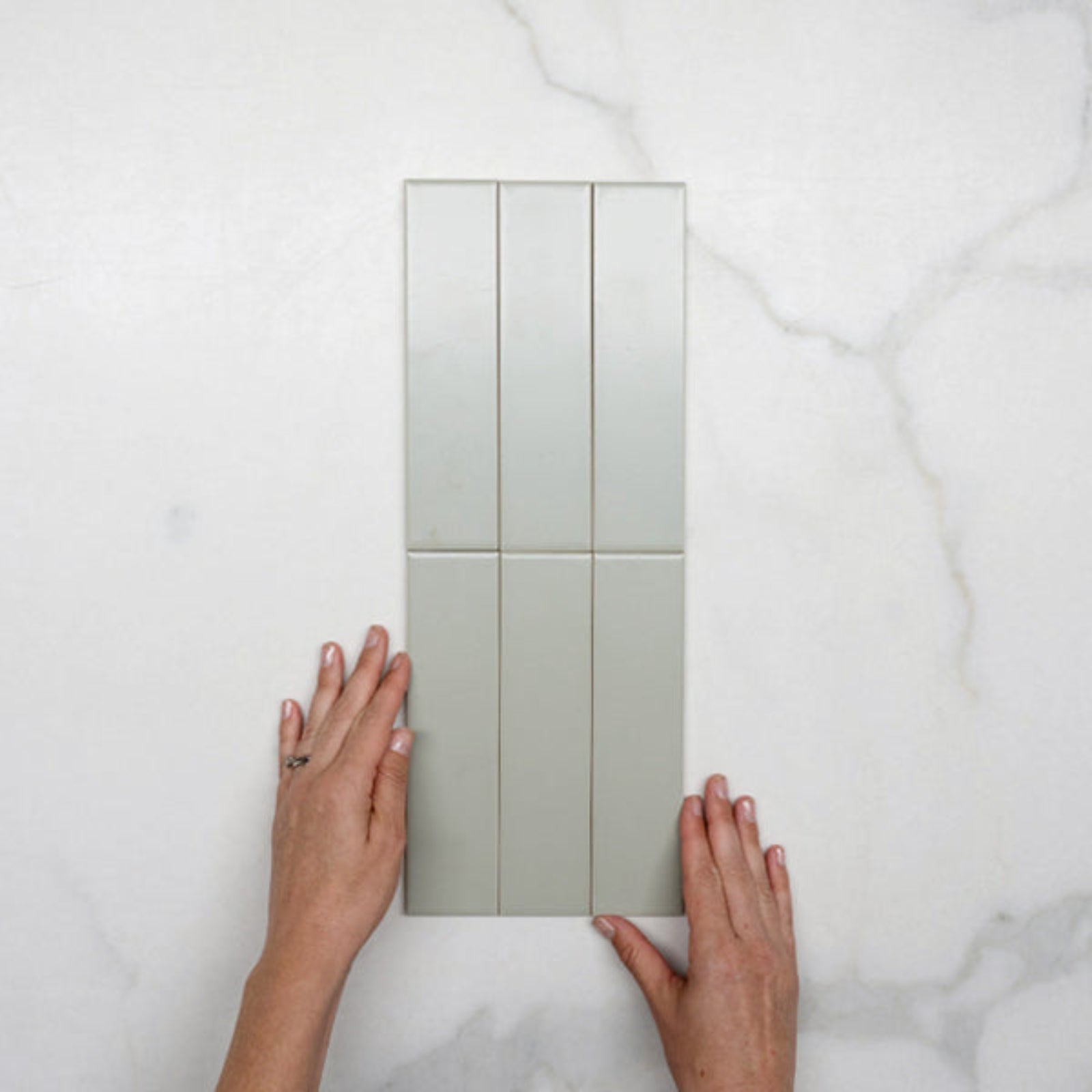 Hero WIth Hand Sunset Sage Avocado Satin Flat Ceramic Tile 50x200mm - The Blue Space