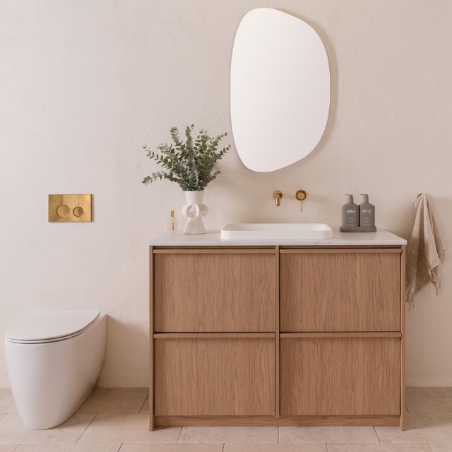 ADP Eli Floor Mount, 1200 Centre Bowl, Boston Oak, 20mm Carrera Cherry Pie benchtop, Pride Semi-Inset basin Matte White, Organic Mirrored Cabinet & Soul Tapware Brushed Brass, Scarabeo Moon Floor Mount Toilet - The Blue Space