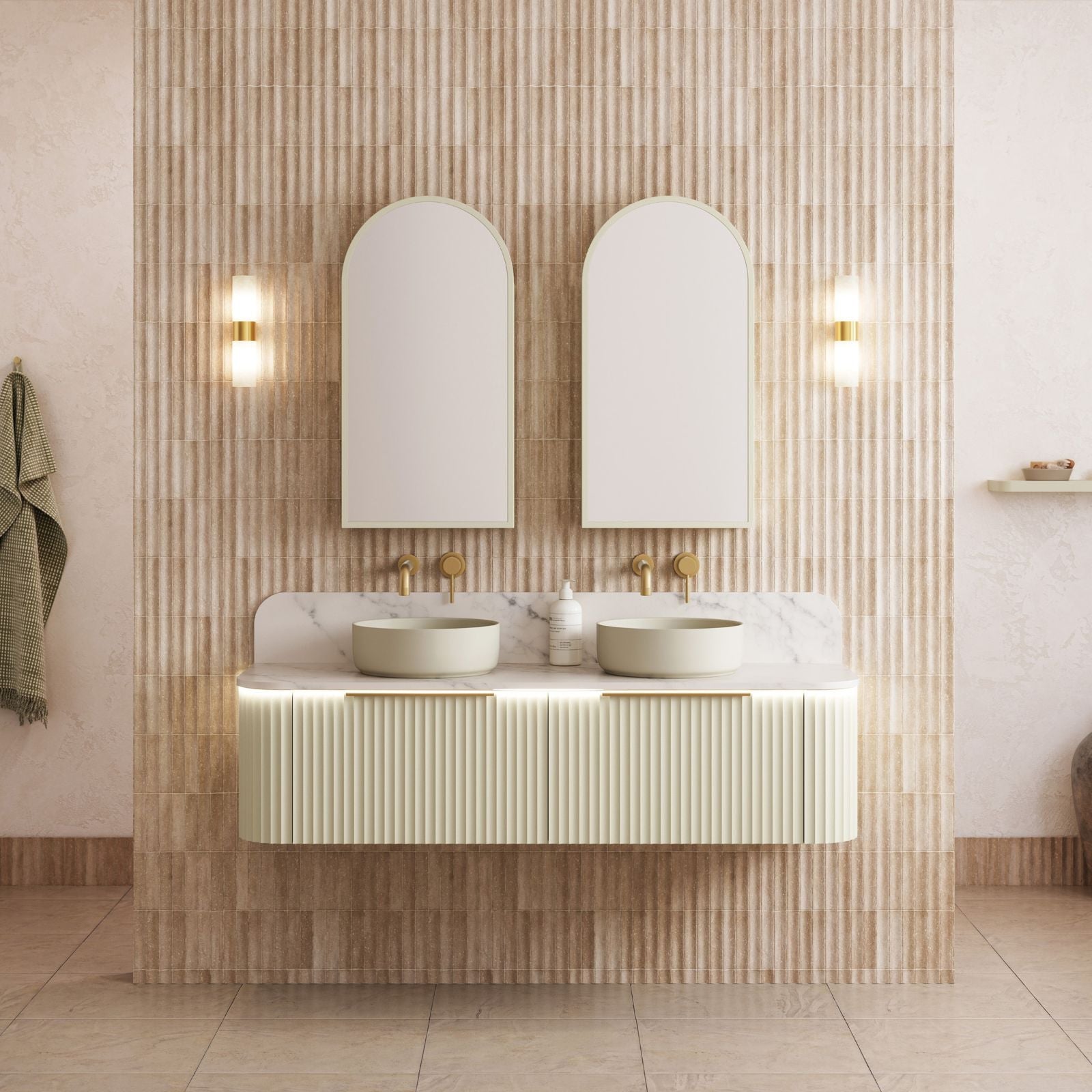 Off white Olivia textured subway wall tile behind Timberline Santos Fluted timber curved wall hung vanity with gold handle. Paired with Phoenix vivid slimline lever taps in brushed gold.