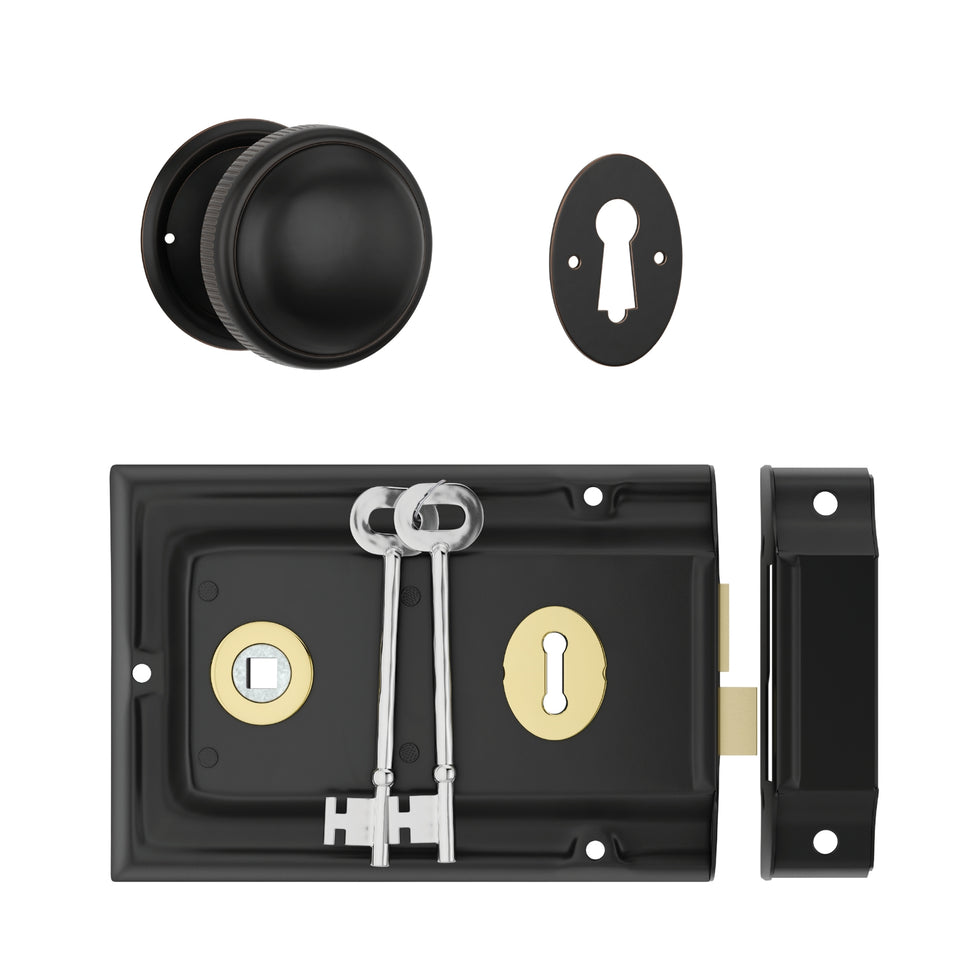 TradCo Rim Lock and Milled Edge Knob Passage Set Matte Black/Antique Copper with Polished Brass Keyhole