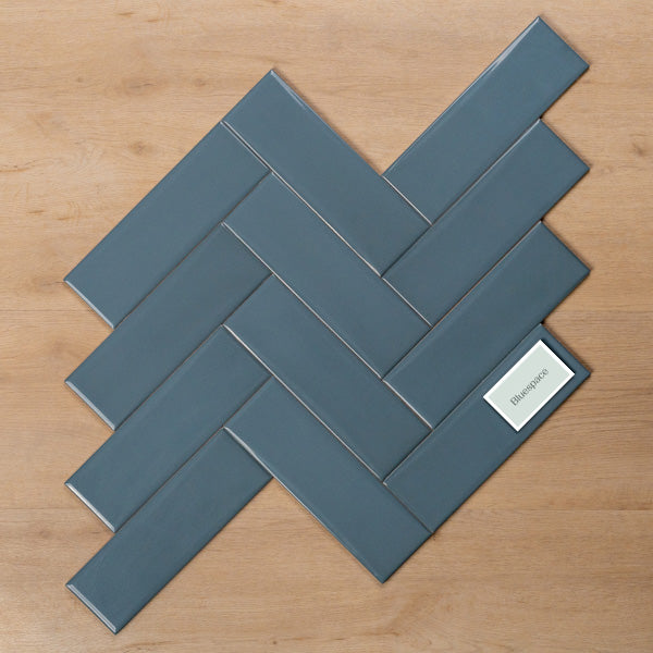 Coolum Blue Gloss Cushioned Edge Ceramic Tile 82x257mm Herringbone Pattern - The Blue Space