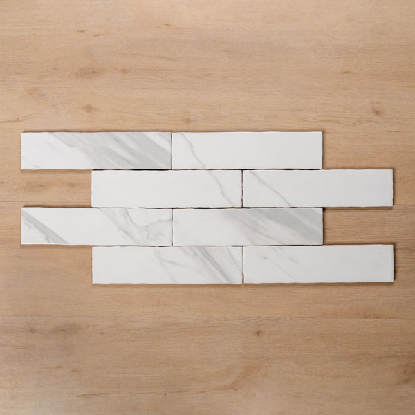 Perisher White Marble Gloss Cushioned Edge Ceramic Subway Tile 75x300mm Brick Pattern - The Blue Space