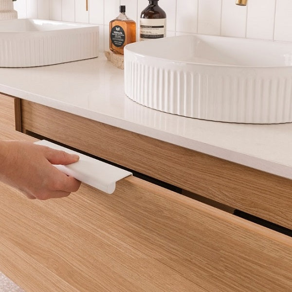 ADP Glacier Shelf in Elegant Oak Woodmatt cabinet finish with Matte White Francis handles in closed up view | The Blue Space