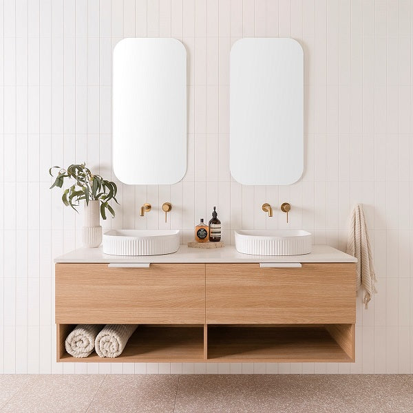 ADP Glacier Pro Shelf Slim 1500 Double Bowl in Elegant Oak Woodmatt cabinet finish with Matte White Francis handles, 20mm Organic White Caesarstone Benchtop and Arch Fluted Basins. Features 2 x 450mm Stadium Mirrors | The Blue Space