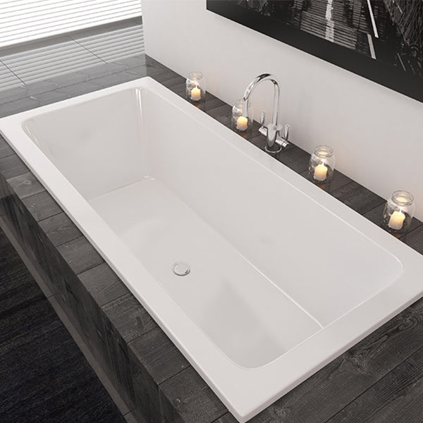 Decina Carina Island Bath with black tiling and candles- The Blue Space