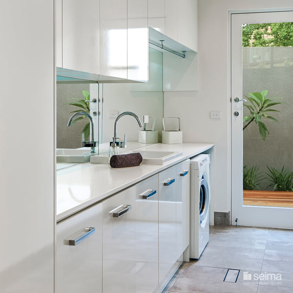 Seima Eva Ceramic Laundry Sink featured in a laundry with white cabinetry