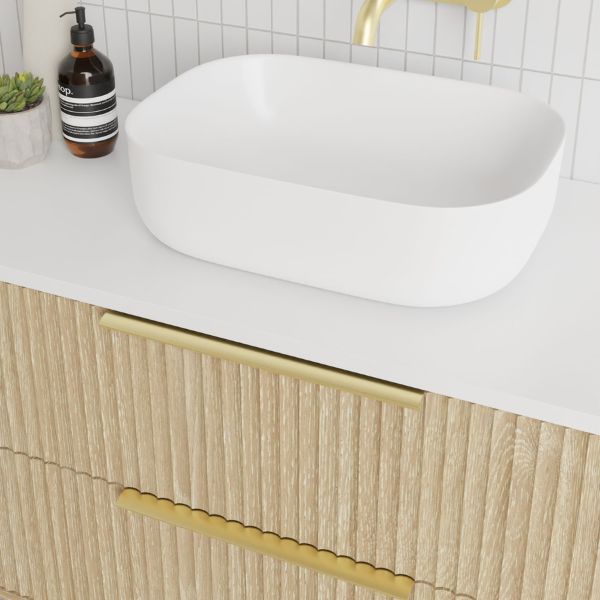 Marquis Lake Wall Hung Vanity 1200mm centre basin in prime oak finish, Symphony Blanco top, glass white basin, brushed brass towel handle and basin mixer features arch mirror in modern bathroom design - The Blue Space