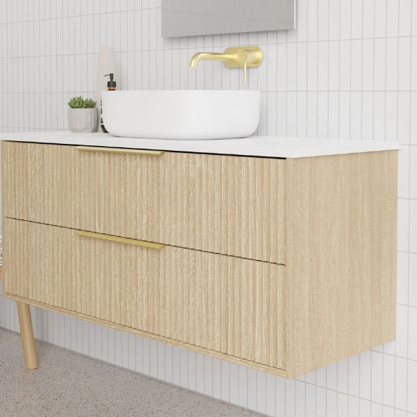Marquis Lake Wall Hung Vanity 1200mm centre basin in prime oak finish, Symphony Blanco top, glass white basin, brushed brass towel handle and basin mixer features arch mirror in modern bathroom design - The Blue Space
