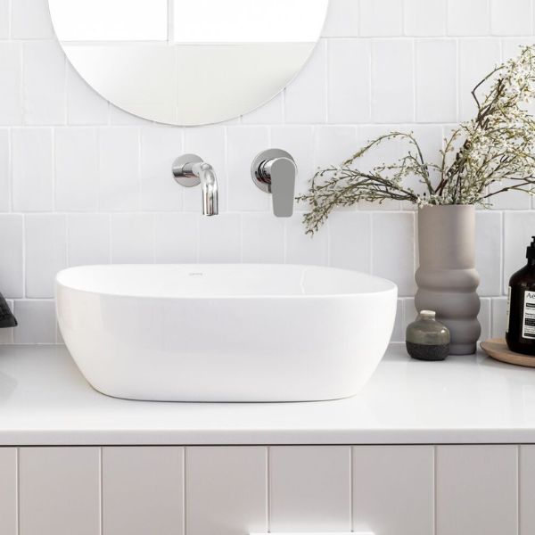 Meir Paddle Round Wall Mixer Chrome features spout and basin in modern bathroom design - The Blue Space