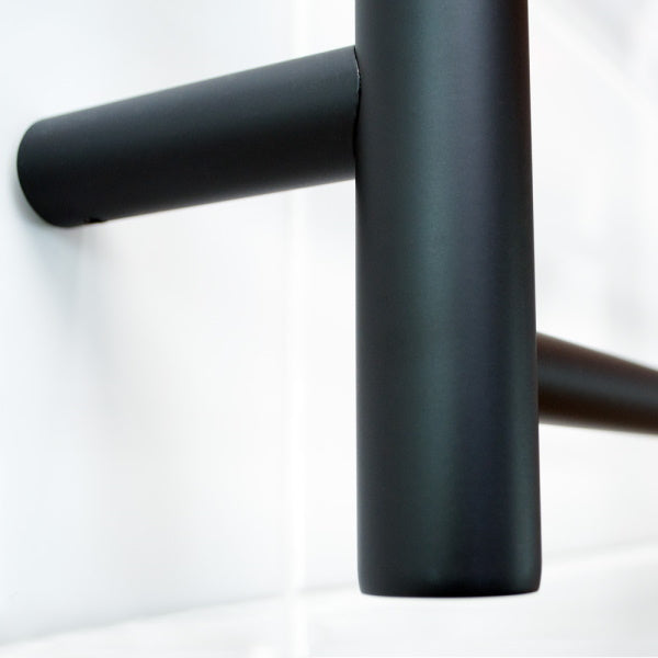 Radiant 12V 7 Bar Round Heated Towel Ladder 600w x 800h close up photo | The Blue Space