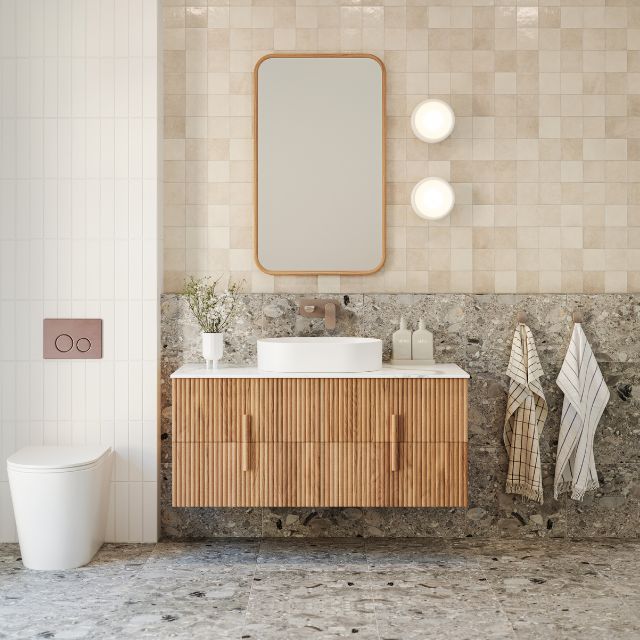 Bao Elegant Matte White Rimless Toilet Suite with behind the wall cistern featuring Nero flush plate and buttons in Brushed Bronze in Warm Neutral bathroom