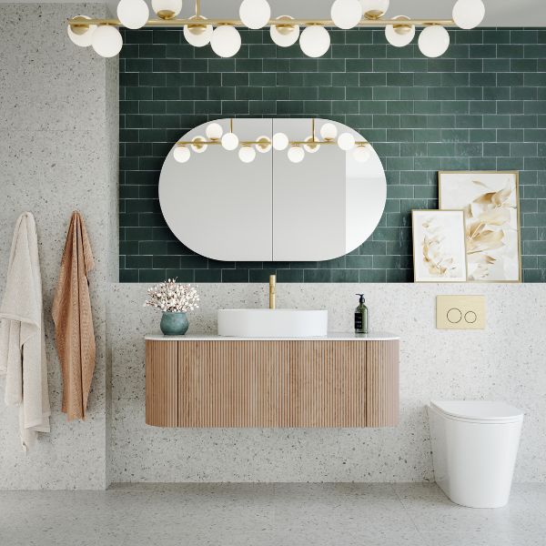 Bao Elegant Concealed Toilet Suite with R&T cistern and Nero flush buttons in brushed gold in hollywood glam bathroom with green feature tiles- The Blue Space