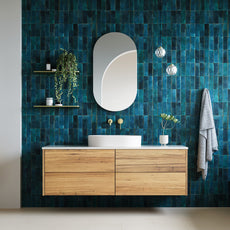 Ingrain Barrington 1500mm Salvaged Timber Vanity in Blackbutt with gold tapware, deep turquoise wall tiles and pill shaped mirror - The Blue Space