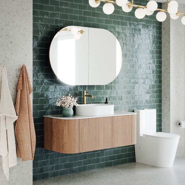 Ingrain Curved Fluted Wall Hung Vanity 1200mm in bathroom with green tiles at The Blue Space