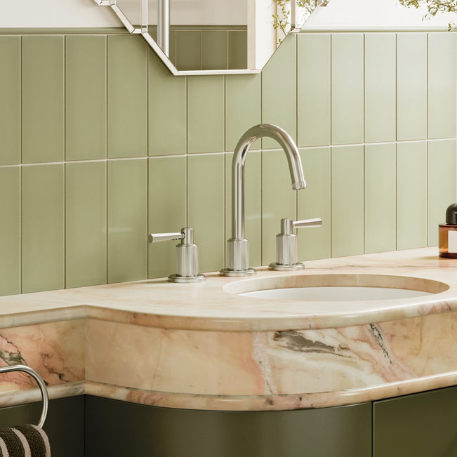 Bathroom sink with marble countertop and green tiled wall. Phoenix Wiltern basin set in brushed nickel. Art Deco bathroom at The Blue Space