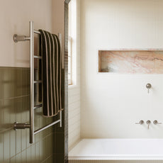 Bathroom interior with towel rack, bathtub, and wall art. Art Deco style bathroom  - Phoenix Wiltern available at The Blue Space
