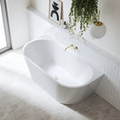 Bao Bon Back to Wall Bath in stylish white minimal bathroom with gold accents. Top view - The Blue Space
