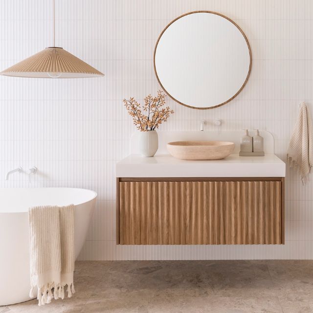 ADP Harper Wall Hung Vanity 1135mm Centre Bowl With Prime Oak Cabinet Finish Arctic White Durasein benchtop and backsplash Ella Framed Mirror and Ollie Travertine Basin & Soul Tapware in Matte White HARFAS1135WHCDU | The Blue Space