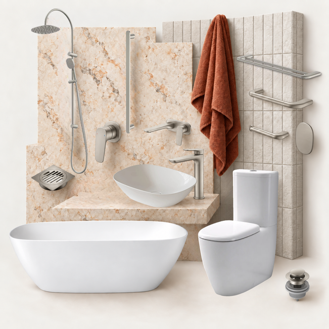 A modern bathroom furniture and fixture set featuring a freestanding white bathtub, a white vessel sink with a chrome faucet, a white toilet, a wall-mounted shower system, a rust-colored towel, and chrome towel bars and shelves against beige marble and tiled walls.