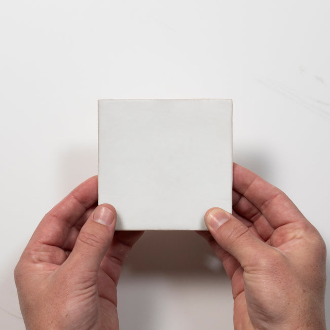 Single with Hand Evelyn Pure White Handmade Zellige Satin Tile 100 x 100mm BYRCH1 - The Blue Space