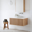 Ingrain Ash Grooved Timber Wall Hung Vanity 900mm in breezy, neutral bathroom. Featuring brushed nickel tapware, Nood Co. Mill basin in Morning Mist, Ingrain LED shaving cabinet and Calacatta White sintered stone benchtop. Available exclusively from The Blue Space.