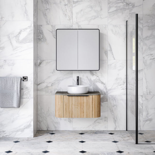 Timberline Santos Curved 750mm Vanity with Apollo fluted front in Oak woodgrain finish. Pictured in contemporary marble bathroom - The Blue Space
