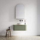 Timberline Santos Curved Wall Hung Vanity 900mm in Satin Olive painted finish. Pictured with crisp, white textural tiled wall, dimpled matte white basin and simple styling