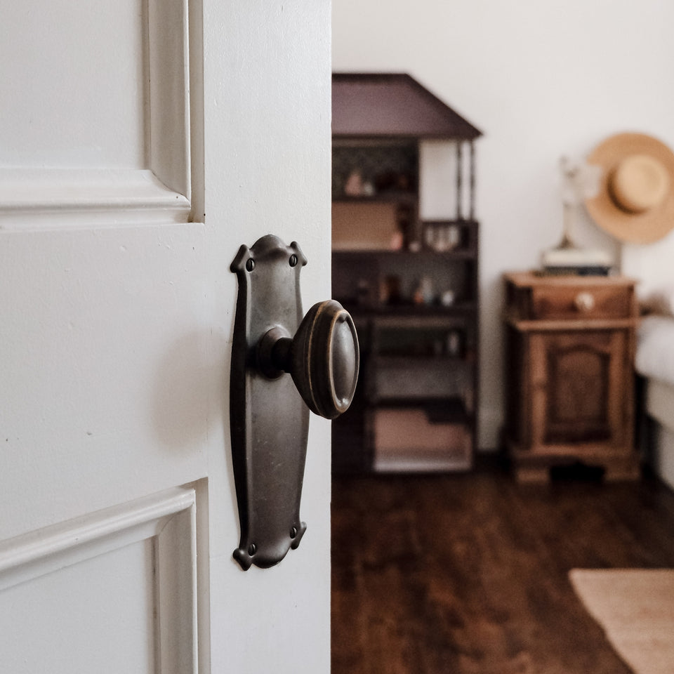 TradCo Bungalow Door Knob Long Backplate Passage Set Antique Brass