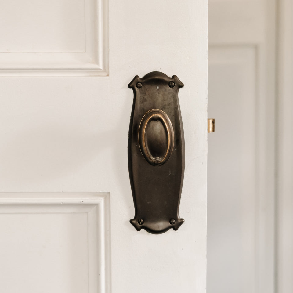 TradCo Bungalow Door Knob Long Backplate Passage Set Antique Brass