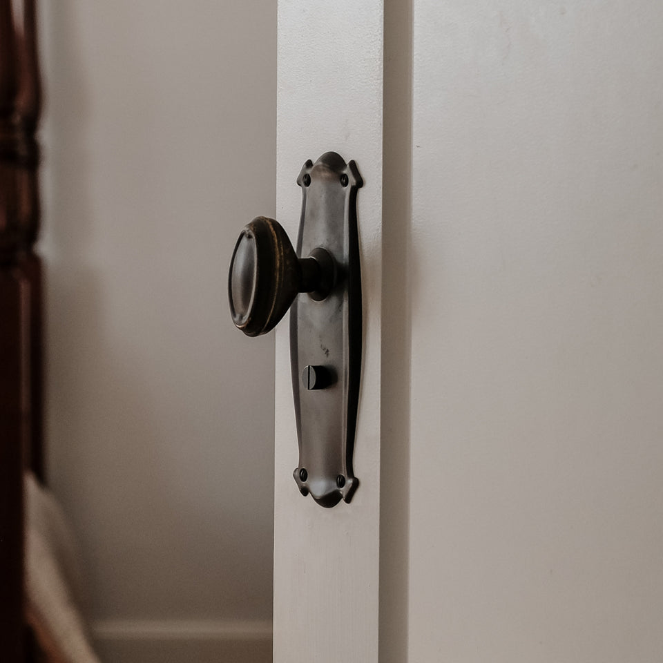 TradCo Bungalow Door Knob Long Backplate Privacy Set Antique Brass