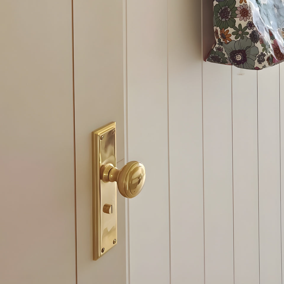 TradCo Milton Door Knob Long Backplate Privacy Set Polished Brass