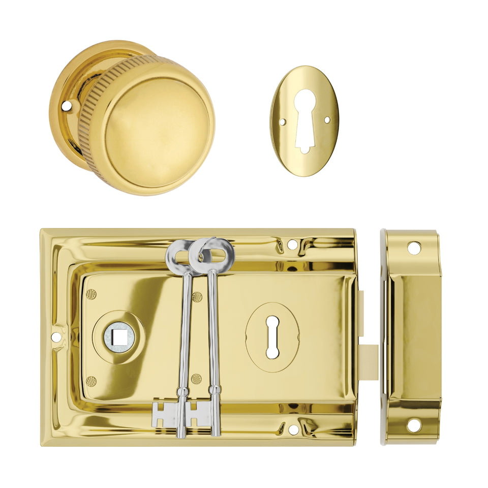 TradCo Rim Lock and Milled Edge Knob Passage Set Polished Brass