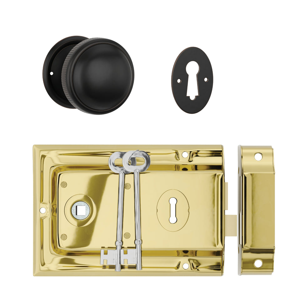 TradCo Rim Lock and Milled Edge Knob Passage Set Polished Brass/Antique Copper