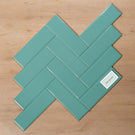 Coolum Green Gloss Cushioned Edge Ceramic Tile 82x257mm Herringbone Pattern - The Blue Space