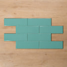 Coolum Green Gloss Cushioned Edge Ceramic Tile 82x257mm Brick Pattern - The Blue Space