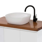 Fienza Eleanor Gooseneck Basin Mixer - Matte Black/Ceramic on a wood top vanity with white basin lifestyle image
