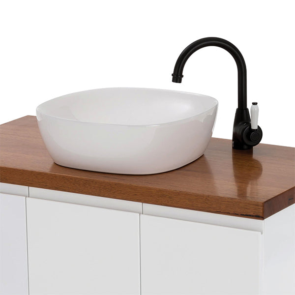 Fienza Eleanor Gooseneck Basin Mixer - Matte Black/Ceramic on a wood top vanity with white basin lifestyle image