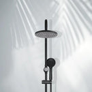 Indigo Ciara Shower on Rail with Overhead Matte Black on white wall with palm tree shadow | The Blue Space