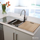 Seima Kubic 1.75 Double Bowl Kitchen Sink featured in a kitchen with white benchtop and chopping board cover